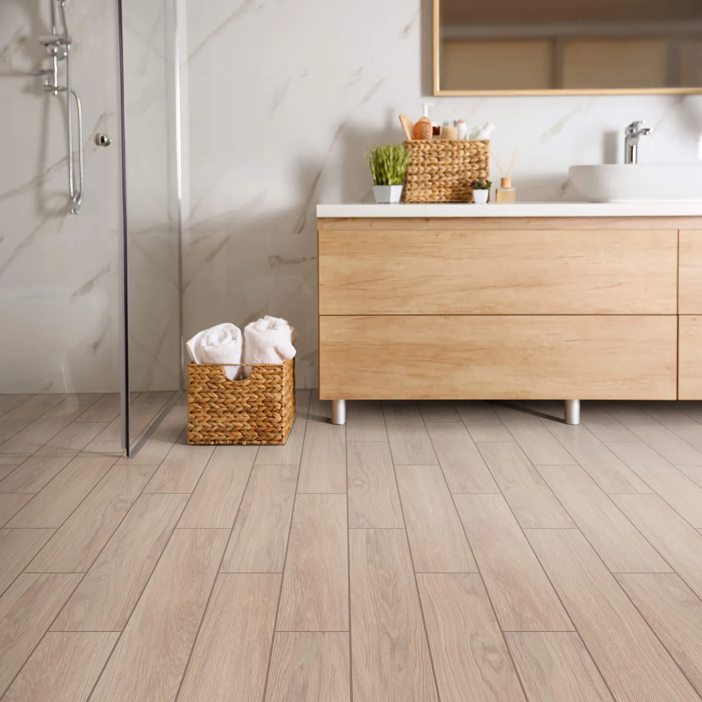 Modern bathroom with wood vanity, white walls, and light flooring | Kay Riley Carpet & Flooring