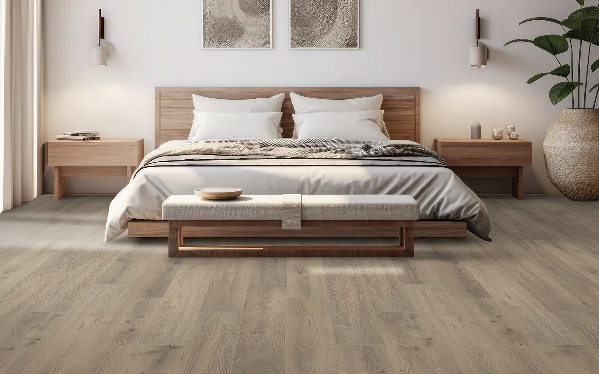 Light wood flooring in a modern bedroom with a wood bed and neutral decor | Kay Riley Carpet & Flooring