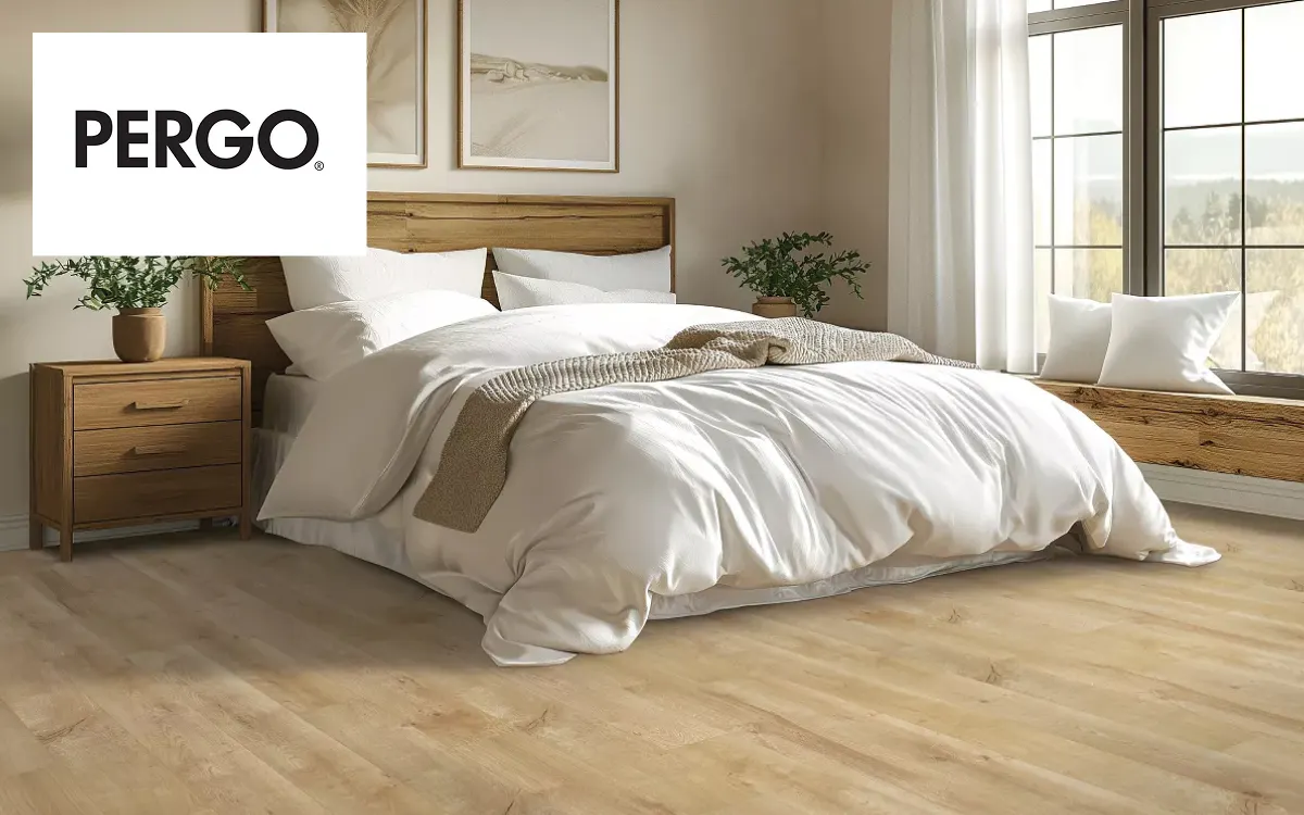 Bright bedroom with Pergo flooring and natural wood tones | Kay Riley Carpet & Flooring